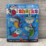 Never Touch The Sharks Board Book