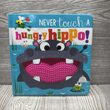 Never Touch A Hungry Hippo Board Book